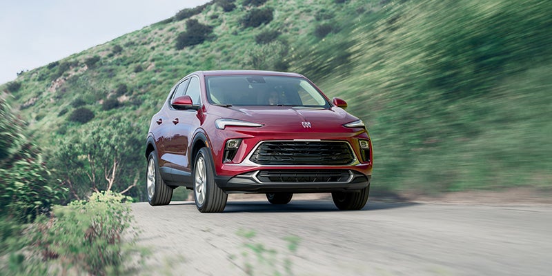 A 2024 Buick Encore GX driving in a country road