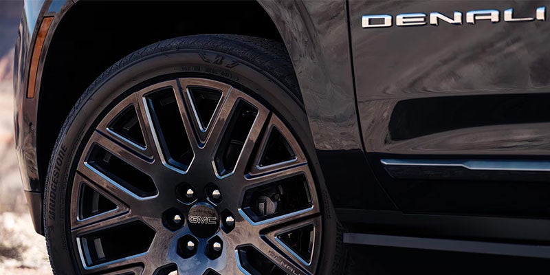 Close-up of the Black Rims on the 2025 GMC Yukon Denali Luxury 3 Row SUV