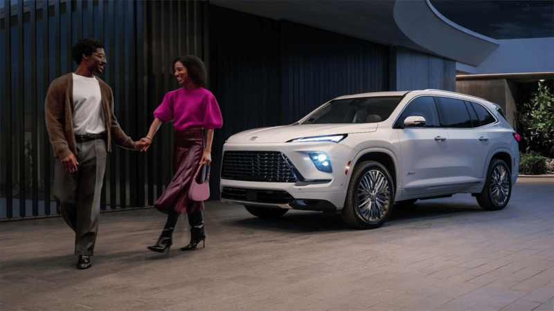 2027 Buick Enclave outside with two people