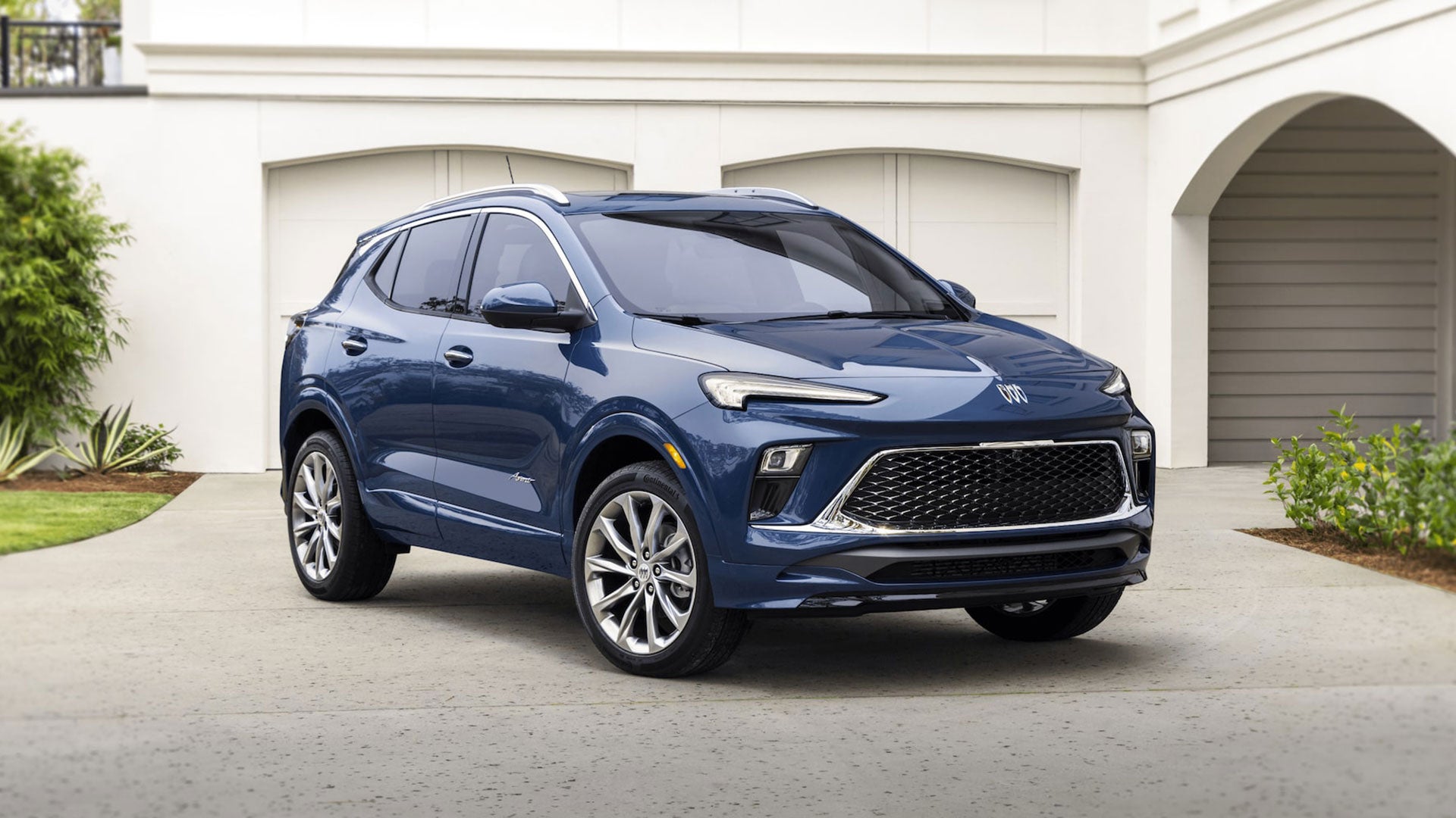 Blue 2024 Buick Encore GX parked in a driveway