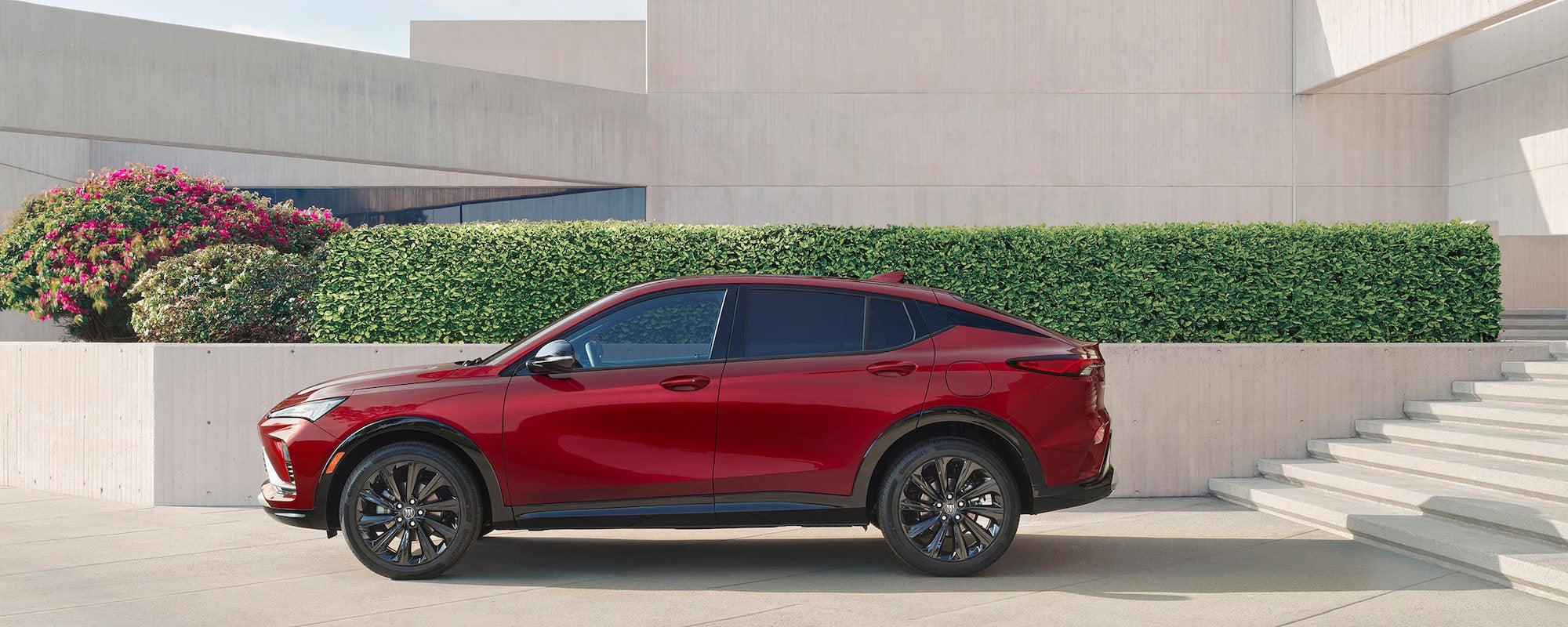 Side View of a Red Parked Buick Envista
