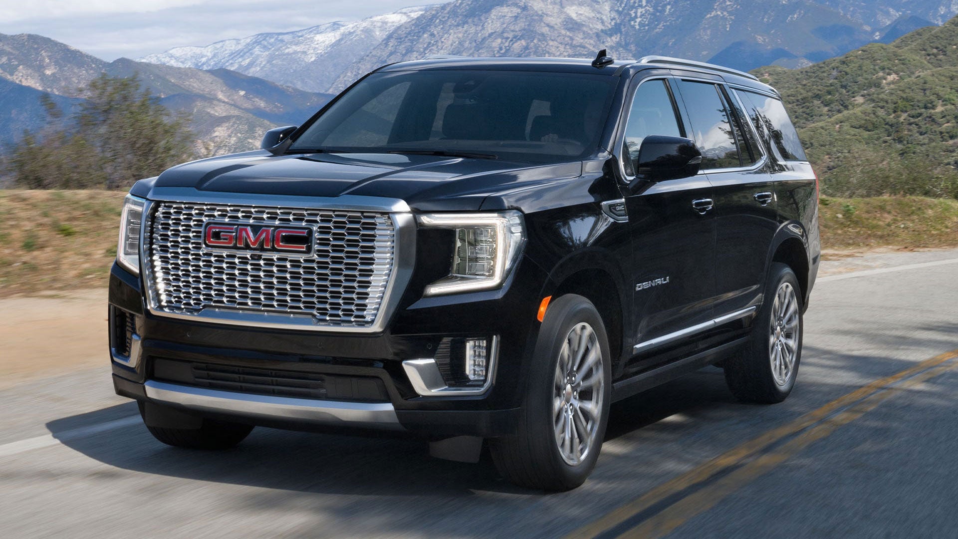 GMC Yukon Denali driving on a mountainous road