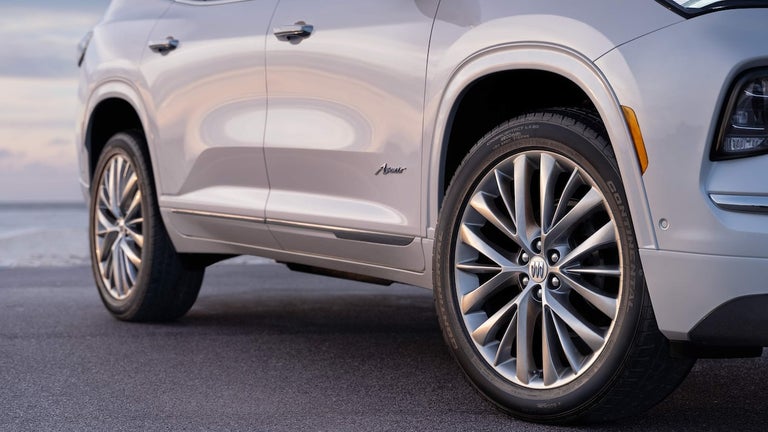 Low Angle View of the Tires and Doors on a 2025 White Buick Enclave