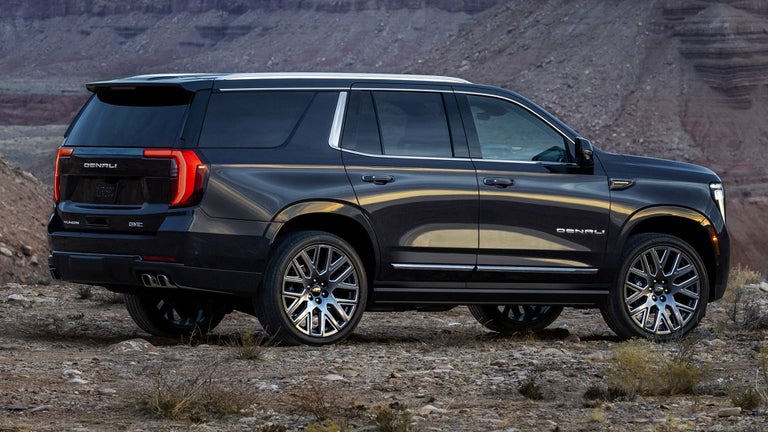 Rear Three-Quarter View of the 2025 GMC Yukon Large SUV Parked in the Desert